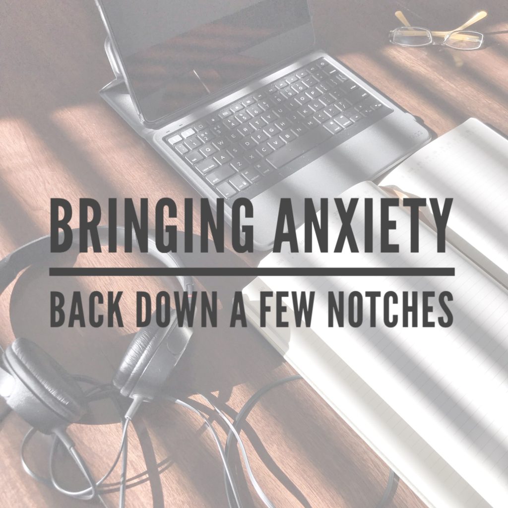 Bringing Anxiety Back Down text over computer headphones and notebook